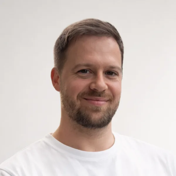 Lennart Hahn, founder of Whisper, studio headshot on a clean light-grey background